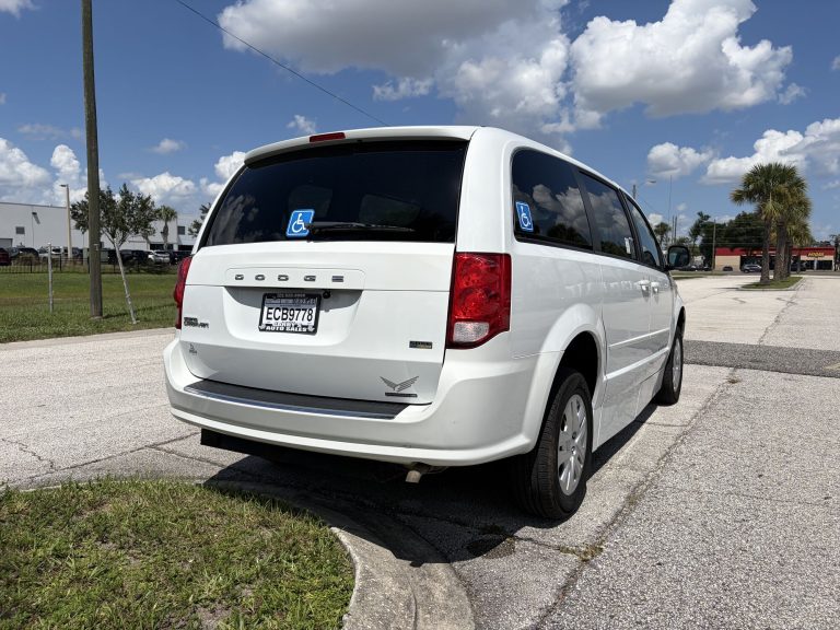 Rear three-quarter view of the wheelchair accessible van with the accessibility decal in the quarter window