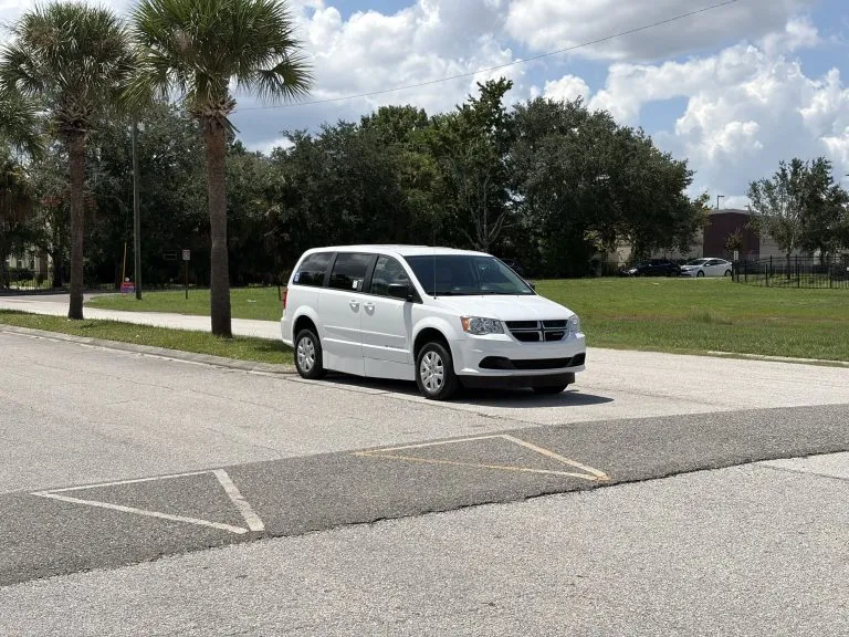 Side profile of the wheelchair accessible van showing the sliding door where the ramp deploys